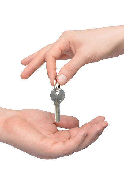 istock Human hand holding house key 458905447