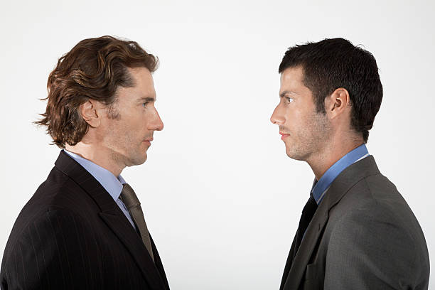 istock Businessmen Face-To-Face On White Background 458906301