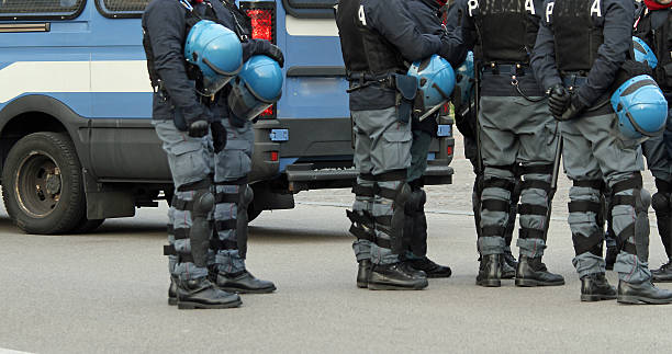 istock policemen with bullet-proof jacket and blue helmet during the re 458919263