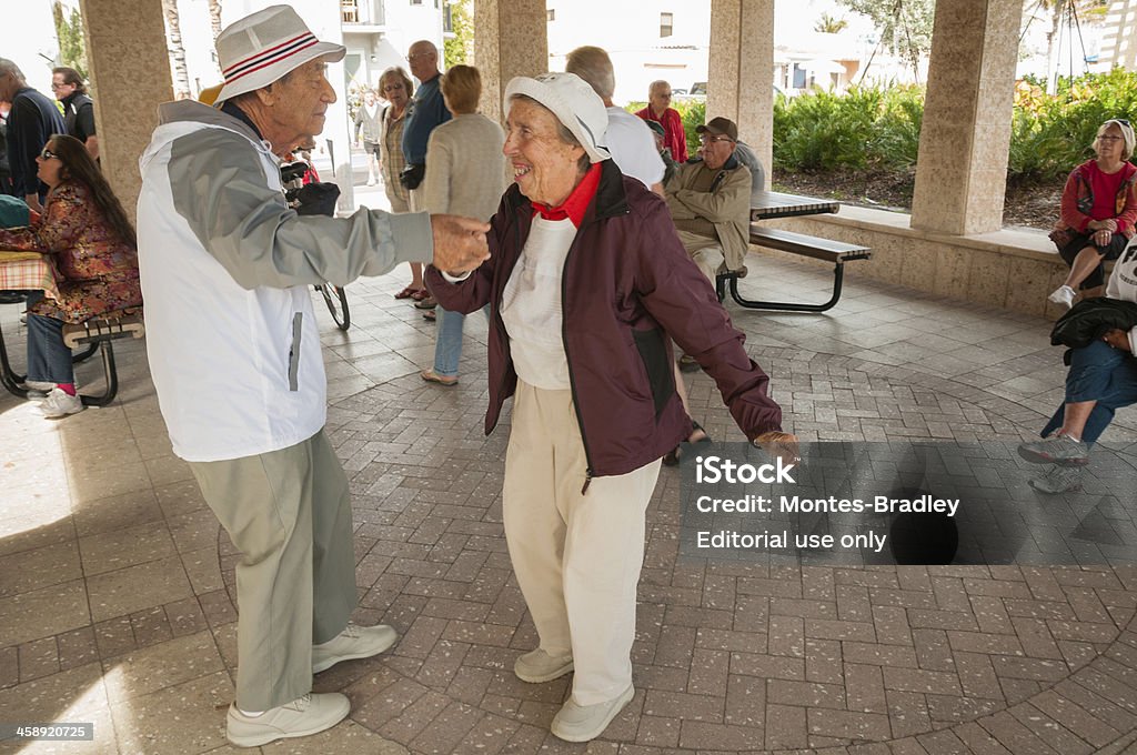 Dancing Centenarians "Hollywood, USA - February 11, 2010: Centenarians celebrate dancing toto the music of life Hollywood's boardwalk, a favorite destination for Northerners in Winter." Florida - US State Stock Photo