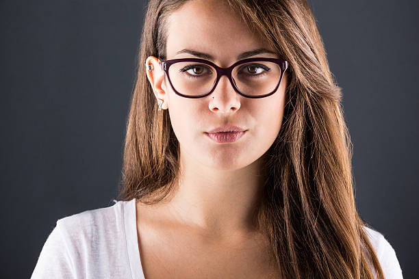 istock Pensive Young Woman on Dark Background 458920749