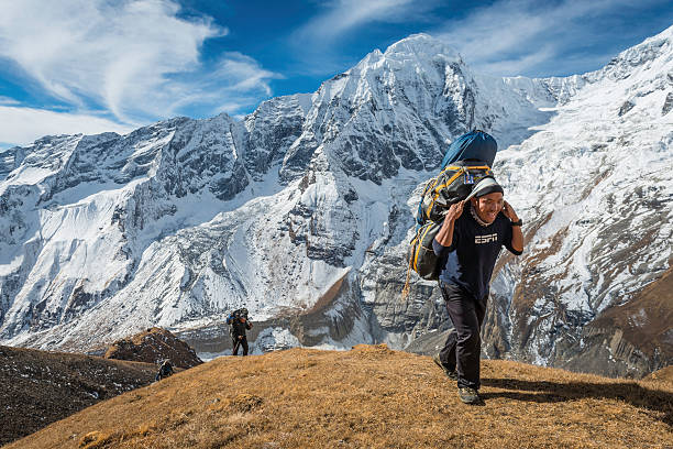 Annapurna South, Mardi Himal and Machapuchare mountain summits snow peaks in Himalayas range, Nepal. Scenic beautiful mountain landscape on the trekking path to Annapurna Basce camp hike