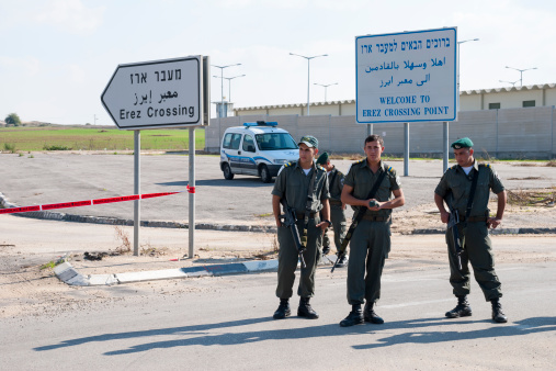 Erez Crossing, Israel - November 18, 2006: A group of Israeli border police stand at the Erez Crossing between Israel and the Gaza Strip