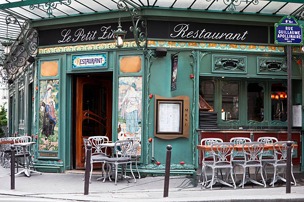 Art Nouveau Restaurant in Saint Germain, Paris, France "Paris, France - April 27, 2012: Art Deco Restaurant in Paris. After World War II, St-Germain-des-Pres became synonymous with intellectual life centred around restaurants, bars and cafes. Philosophers, writers, actors and musicians mingled in the cellar nightspots and brasseries, where existentialist philosophy coexisted with American jazz. The writers are still around, enjoying the pleasures of sitting in restaurant Le Petit Zinc." restaurant france stock pictures, royalty-free photos & images