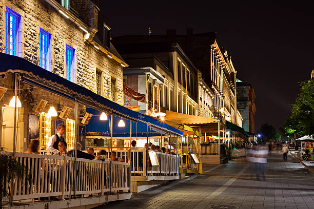 Montreal, Canada, Restaurants "Montreal, A!anada - June 15, 2011: Patrons enjoying dinner in the restaurants on Place Jacques-Cartier in Old Montreal." place jacques cartier stock pictures, royalty-free photos & images