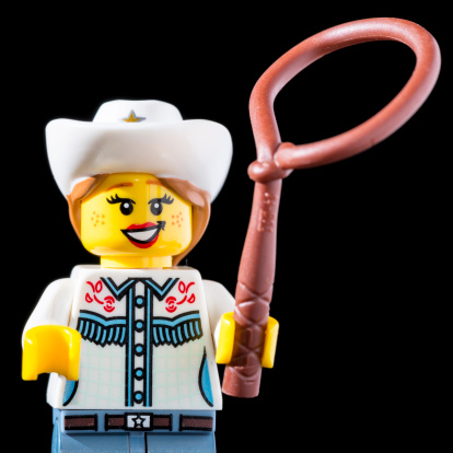 Borgosesia, Italy - November 8, 2012: Close up of the 'Cowgirl' character from the Lego Minifigures series 8 by the Danish company Lego Group.