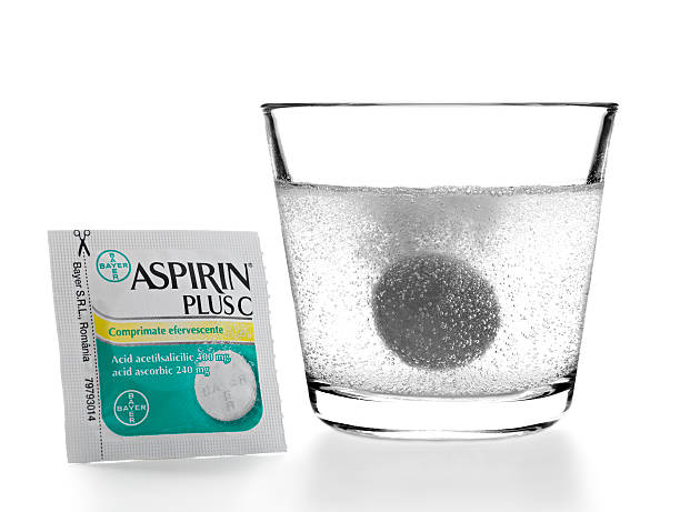 Effervescent Aspirin "Bucharest, Romania - June 29, 2012: a studio product shot of a Bayer Aspirin Plus C blister and a pill dropped into the water, isolated on white" bayer schering pharma ag photos stock pictures, royalty-free photos & images