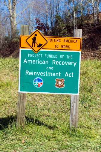 Damascus, VA, USA - October 25, 2012: The American Recovery and Reinvestment Act of 2009 (Recovery Act) was signed into law by President Obama on February 17th, 2009. The U.S. Forest Service was designated funds from this act. Here is a sign on the Virginia Creeper Trail, where funds were being used by the U.S. Forest Service to improve this popular bike riding trail.