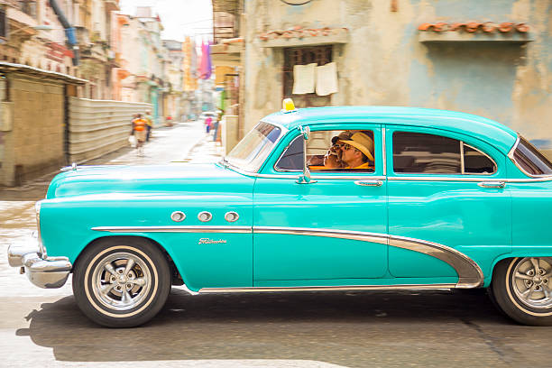 Havana, Сuba - November 15, 2012: Taxi (well mantained Buick Special) with passengers driving on the streets of Centro Habana.