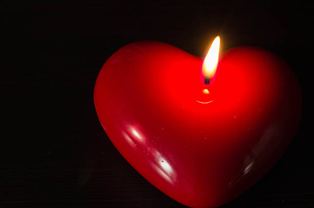 istock Red candle in the form of heart 458928543