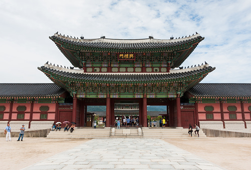 Seoul, Korea - September 14, 2012: Tourists visit Gyeongbokgung Palace, Ancient Korean palace.This is South Korea's National treasure. The picture of the gates of the palace, Gyongbokkung Entrance.To travel to Seoul will visit here.
