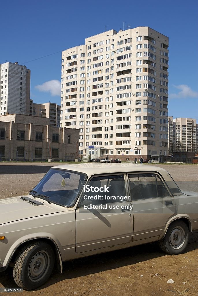 Old Soviet car "St. Petersburg, Russia aa 1 May 2007A :Old Soviet car parked in a desolated courtyard overlooked by a high-rise, on Vasilievsky Island." Abandoned Stock Photo