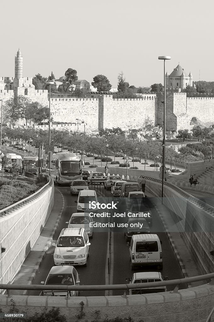 Traffic in Jerusalem Jerusalem, Israel - October 5, 2010: Cars and buses entering and exiting central Jerusalem on Highway 60 drive past the old city walls. Incoming traffic is about to enter the HaTsanhanim Tunnel. Jerusalem Stock Photo