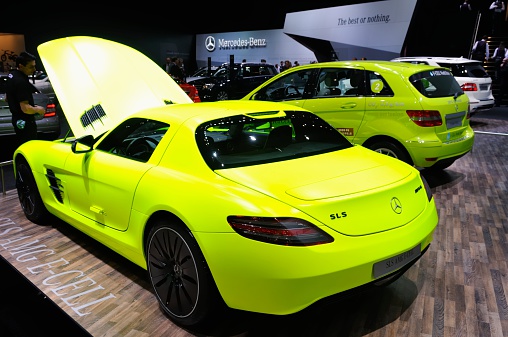 Brussels, Belgium - January 10, 2012: Mercedes-Benz SLS Fuel Cell World Drive concept car on display during the 2012 Brussels motor show. People in the background are looking at the cars.