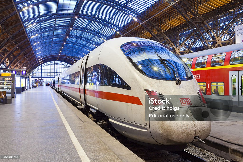 ICE train, Leipzig, Germany "Leipzig, Germany - August 26, 2011: View of the rear of an Intercity Express (ICE) train that is stopped at platform of the Leipzig main train station. Some people can be seen on the platform in the background." Ice Stock Photo