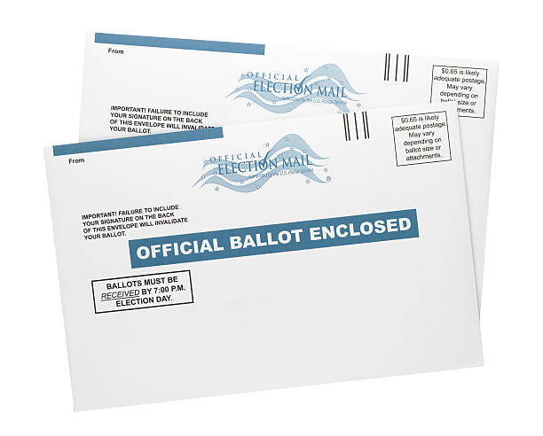 Mail-in Ballots "Colorado Springs, Colorado, USA - September 20, 2012: Two official US mail-in ballot envelopes shot in the studio and isolated on a white background. Mail-in ballots enable a person to vote through the mail instead of in person at a polling place." absentee ballot photos stock pictures, royalty-free photos & images