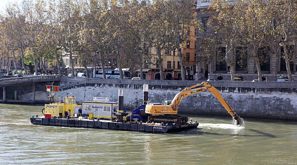 dredeger в лион, франция - industrial ship earth mover barge yellow стоковые фото и изображения