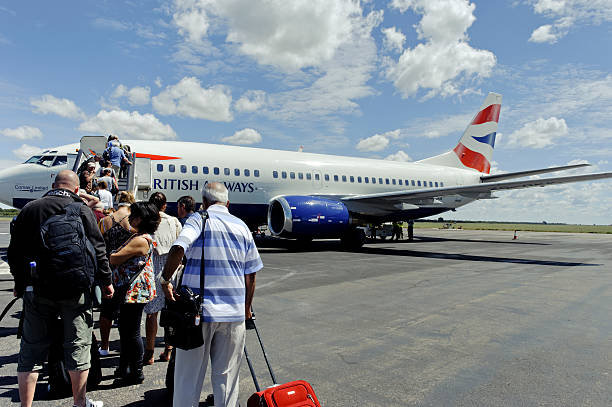 Tourist boarding British Airways Boeing 737-300, Victoria Falls,Zimbabwe stock photo