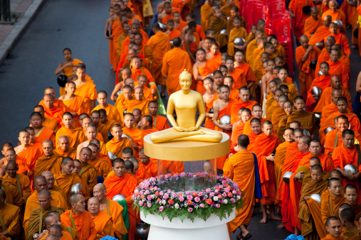 Bangkok, Thailand - March 17, 2012: Monks are participating in a Mass Alms Giving in Saphan Khwai for the Makha Bucha celebrations in Bangkok, Thailand