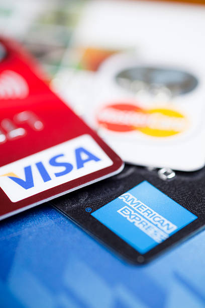 Credit Cards "Adelaide, Australia - March 04, 2012: Close up of credit cards, American Express, Visa and Mastercard" american express stock pictures, royalty-free photos & images