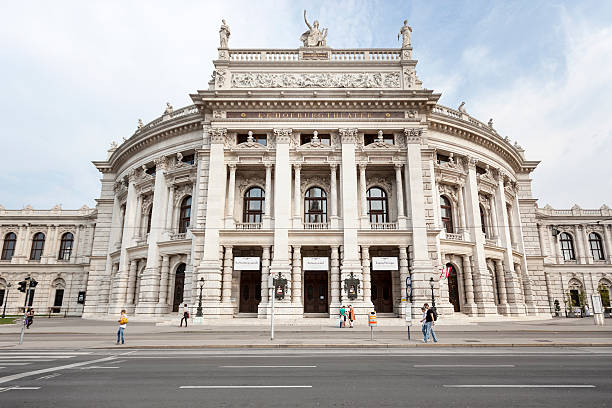 Burgtheater Vienna "Vienna, Austria - September 4, 2012: Facade of Burgtheater Wien (Vienna) - in the foreground some pedestrians and tourists. Burgtheater is the Austrian National Theatre in Vienna, it is situated at the Ringstrasse and was opened on October 14, 1888. It is one of the most important German language theatres in the world." burgtheater vienna stock pictures, royalty-free photos & images