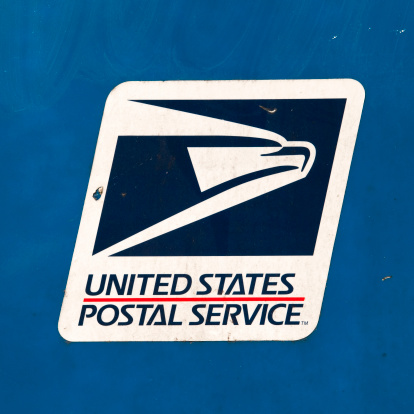 Eugene, OR, USA - March 31, 2012: United States Postal Service logo and symbol on an outdoor mailbox.