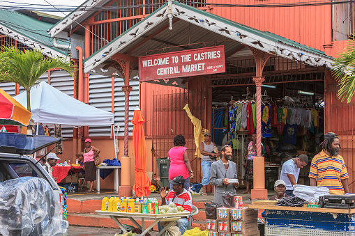 Castries, Saint Lucia - November 26, 2011: People and vendors at the Castries Central Market, on Jeremie Street in the city downtown. This is the best place to find crafts, food, and especially to meet the locals.