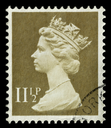 Yateley, Hampshire, UK - September 28, 2012: Isolated Queen Elizabeth II mail stamp printed in the UK to celebrate her coronation to the British and Commonwealth throne on June 2, 1953.