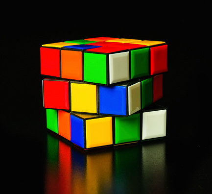 Istanbul, Turkey - January 04, 2011: A Classic Rubik's Cube on a black background.  Rubik's Cube invented by a Hungarian sculptor and professor Ernő Rubik in 1974.