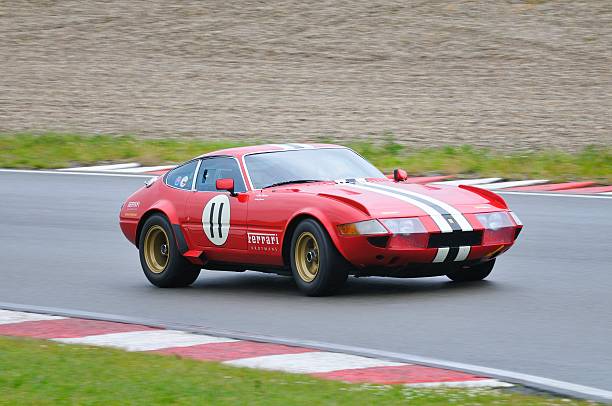 Zandvoort, The Netherlands - June 24, 2012: Red classic Ferrari 365GTB/4 Daytona sports car driving around the race track during the 2012 Italia a Zandvoort day.
