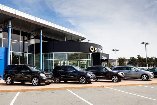 Halifax, Nova Scotia, Canada - September 18, 2011: Mercedes Benz Smart Car dealership in Halifax, Nova Scotia.  Showroom is behind vehicles that are in a row in front.  Vehicles shown include a GL-Class, an ML-Class, a GLK-Class, and an R-Class.  This car dealership is the only one in Halifax that sells new Mercedes Benz and Smart Car vehicles.