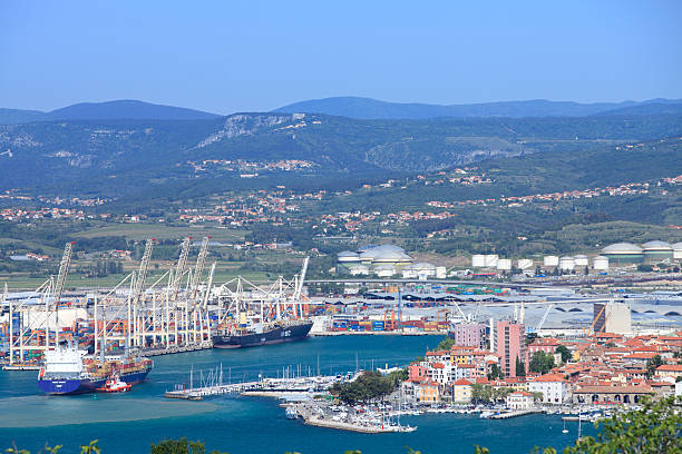 Koper Capodistria and its port "Koper, Slovenia - May 18th, 2012: Koper is a major container port in Adriatic region. During the day tens of medium size cargo ships arrive to the port. Nearby is the old part of Koper city." primorska stock pictures, royalty-free photos & images