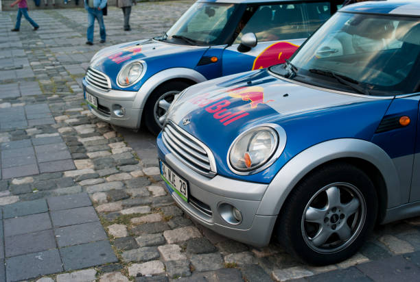 Redbull Bmw Mini Cooper Cars "Izmir, Turkey - May 17, 2012: Redbull sponsored event in Gundogdu Square in Alsancak district. Redbull logo designed Bmw Mini Cooper cars parked at the event area." red bull mini stock pictures, royalty-free photos & images