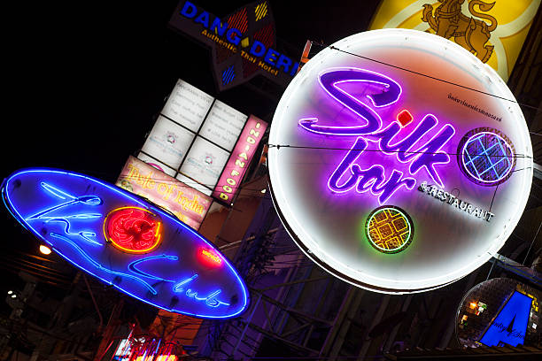 Close-up of a red neon sign for a Bar.