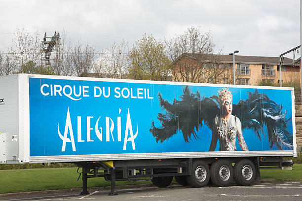 Cirque Du Soleil Glasgow, UK - April 12, 2012: One of the many transport lorries that both carry and advertise the Cirque du Soleil touring show "Alegria". Cirque du Soleil are an entertainment company based around circus arts and performance with headquarters in Montreal, Canada. cirque de soleil stock pictures, royalty-free photos & images