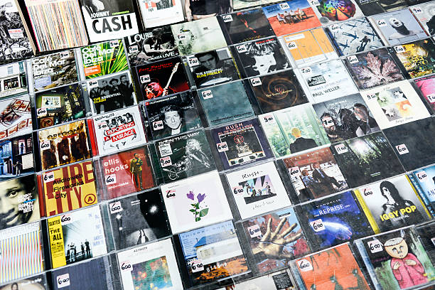 Several CDs from different artists in a store window "Turin, Italy - November 1, 2012: Several CDs from different artists in a store window in Turin" cd rom stock pictures, royalty-free photos & images