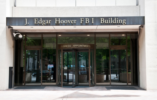 Washington DC, USA - June 13, 2012: Business appointment entrance to the J. Edgar Hoover FBI Building in Washington DC. Hoover, after whom the building is named, was instrumental in founding the FBI in 1935. He was also its first director.