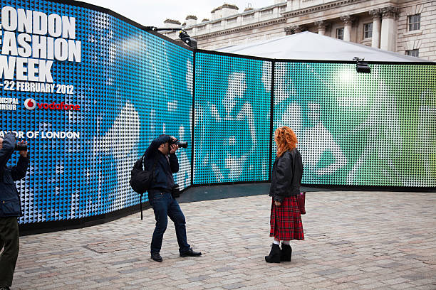 London Fashion Week "London, United Kingdom - February 18, 2012: Fashion student and photographers outside Somerset House during London Fashion Week. London Fashion Week 2012 was held at various venues in the city but was centred at Somerset House." london fashion week stock pictures, royalty-free photos & images