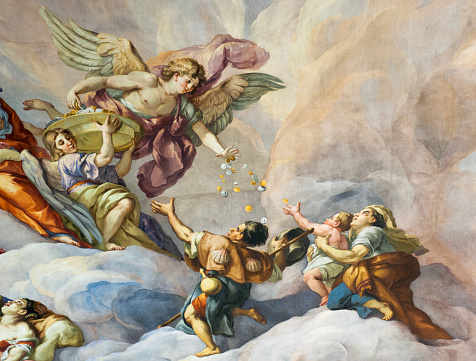Vienna, Austria - January 9, 2012: Detail showing part of the 18th Century fresco on the interior of the main dome of Karlskirche (St. Charles's Church) in Vienna.  The fresco was painted by Johann Michael Rottmayr and Gaetano Fanti, and illustrates the Christian virtues of faith, hope and love.
