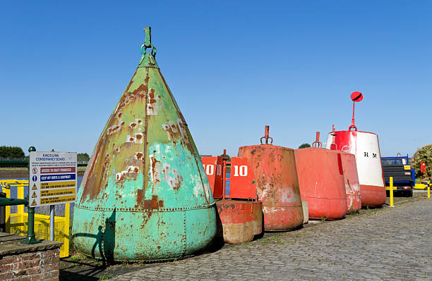 fila di buoys, king's lynn - editorial safety in a row industry foto e immagini stock