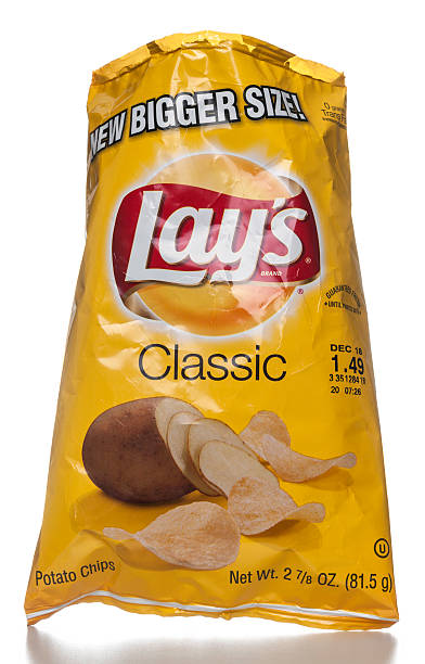 Lay's Classic Potato Chips open bag "Miami, USA - October 25, 2012: Lay's Classic Potato Chips open bag. Lay's brand is owned by PepsiCo." lays potato chips stock pictures, royalty-free photos & images