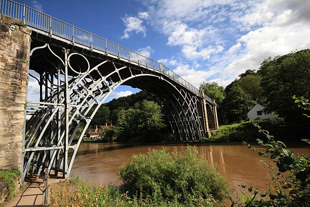 Ironbridge Shropshire "Shropshire, UK - July 15th, 2012: Ironbridge spanning over the river Severn in Shropshire. It was the first arch bridge in the world to be made out of cast iron" ironbridge shropshire stock pictures, royalty-free photos & images