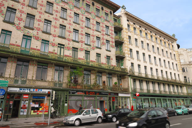 Vienna, Austria - April 12, 2012: Otto Wagner Apartments at Linke Wienzeile 38 and 40 in Vienna. Left building is famous Majolikahaus covered with ceramic tiles with floral pattern. This buildings are example of Secession style. In the ground floors are shops and upper floors are apartments.