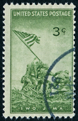 postage stamp with US flag and the White House.
