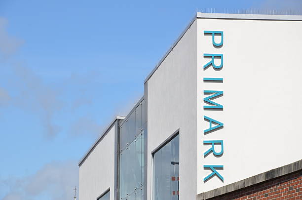 Primark Building Bournemouth, UK - June 6, 2012: The outside of the Primark clothes store in Bournemouth on a sunny day. Large vertical Primark logo on side of building. bournemouth england photos stock pictures, royalty-free photos & images