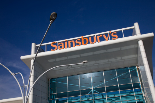 Bournemouth, England - October 15th 2012: Sainsburys Supermarket Logo on a bright sunny autumn morning. Located at Castlepoint shopping centre in Bournemouth, south coast of England. Sainsburys is the third largest supermarket chain in the UK after Tesco and Asda. But more upmarket. 