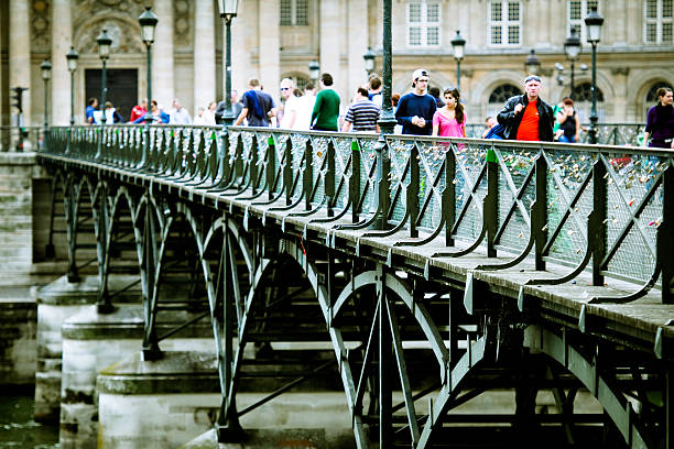 Padlocks on a bridge over the Seine river in Paris, France