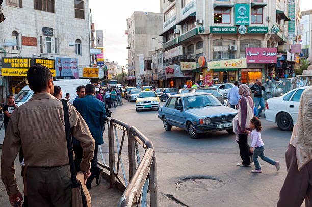 Ramallah, West Bank, Palestinian Territories - October 25, 2010: Traffic and pedestrians at the Manara, the central traffic circle in downtown Ramallah. Located several miles north of Jerusalem, Ramallah is the seat of the Palestinian Authority government.