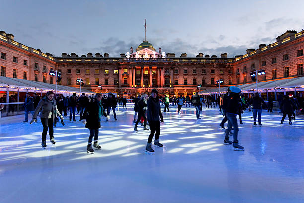 Skate at the Somerset House "London, UK - December 01, 2012: People skating after sunset at the temporary ice rink in the courtyard of the Somerset House in London." university of london photos stock pictures, royalty-free photos & images