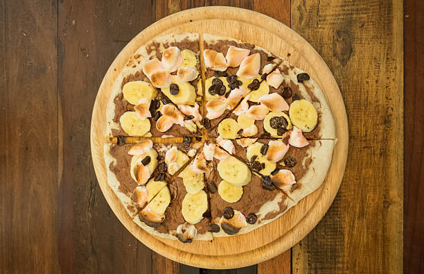istock Dessert pizza with chocolate banana and marshmallow. 458954869
